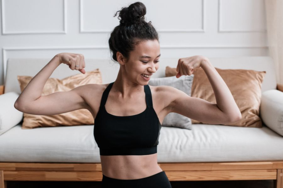 a woman flexing her muscles